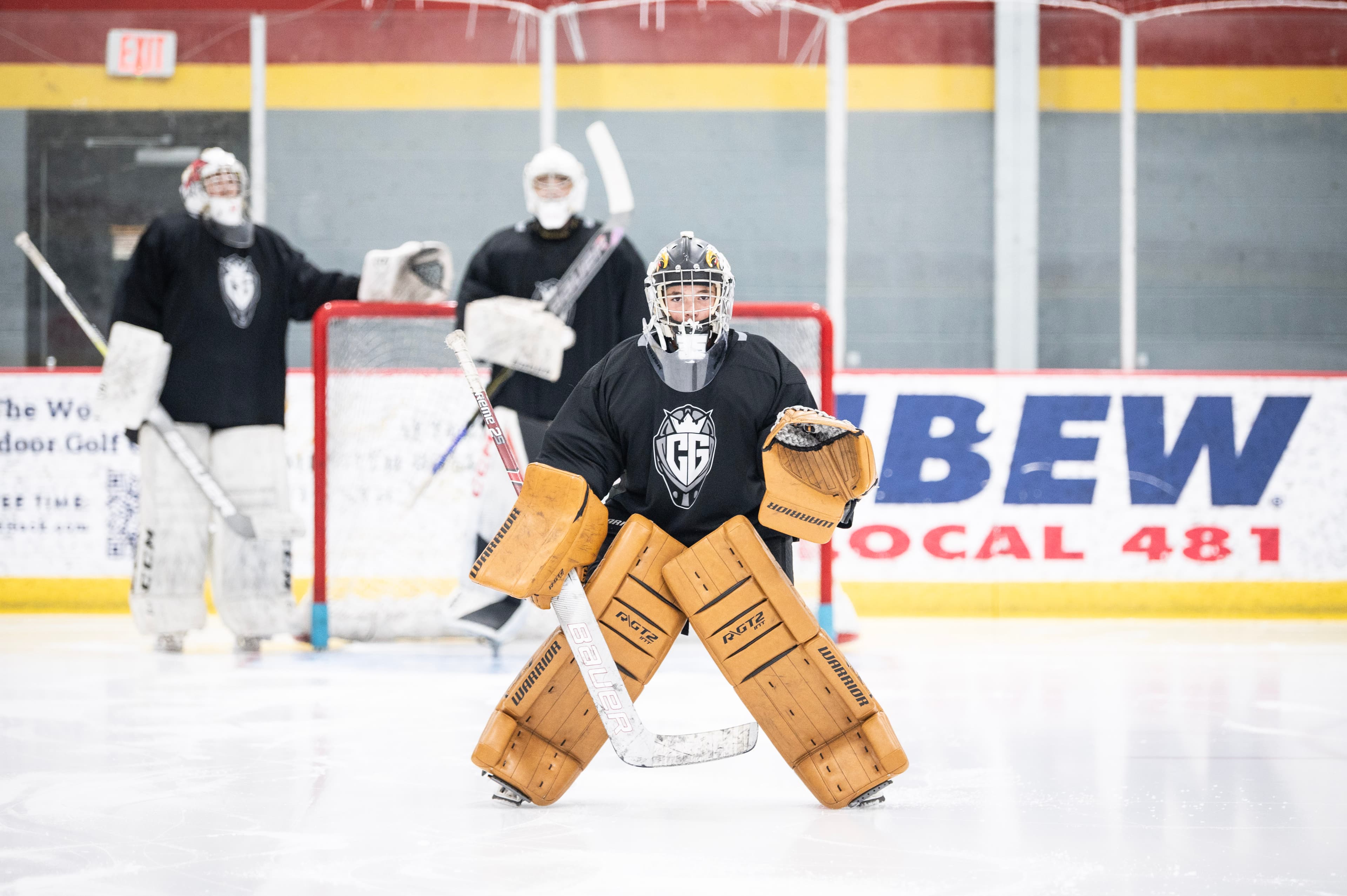 Three goalies lined up in net