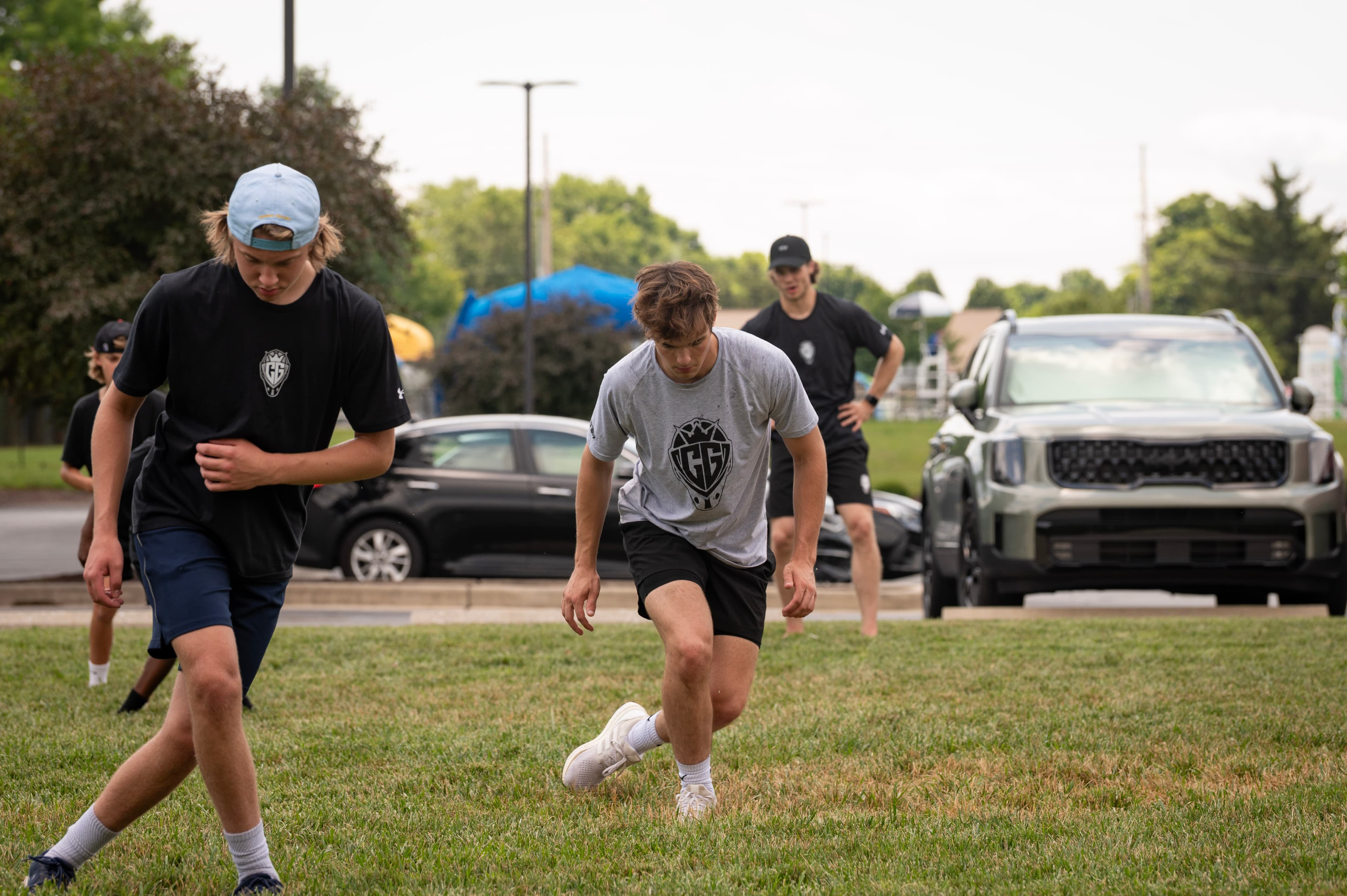 Goalies training outdoors on grass in the off-season