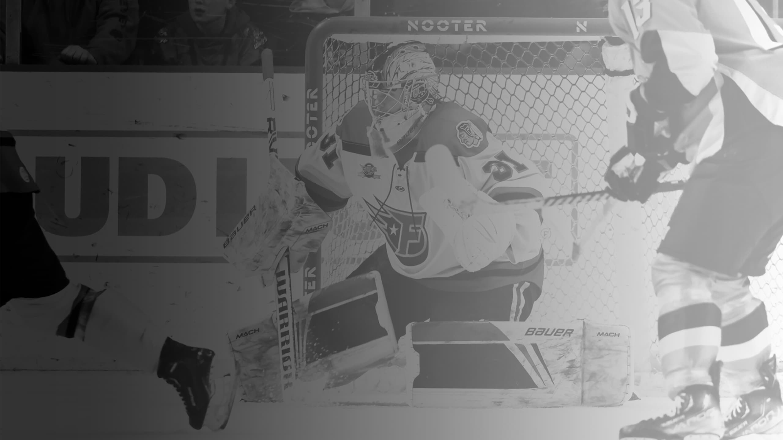 Goaltender making a glove save